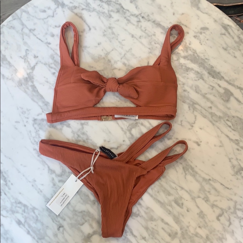 Beautiful rust colored bikini. New with tags